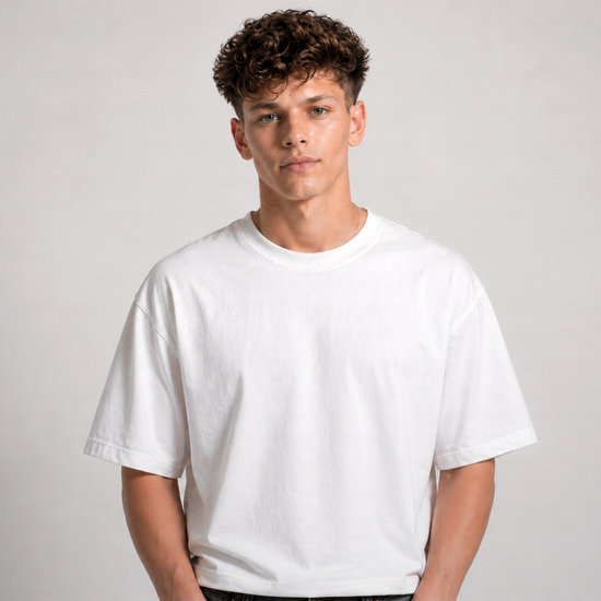 Person wearing a plain white t-shirt against a light gray background