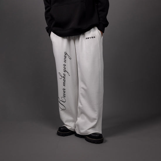REVER – Baggy Pants – Off White PRINTED Baggy Pants – Premium soft fabric, relaxed fit for ultimate comfort and effortless street style.