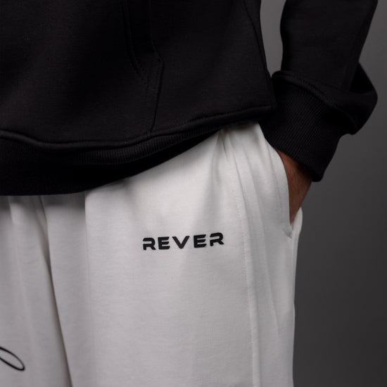 REVER – Baggy Pants – Off White PRINTED Baggy Pants – Premium soft fabric, relaxed fit for ultimate comfort and effortless street style.