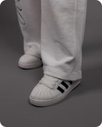 REVER – Baggy Pants – Off White PRINTED Baggy Pants – Premium soft fabric, relaxed fit for ultimate comfort and effortless street style.