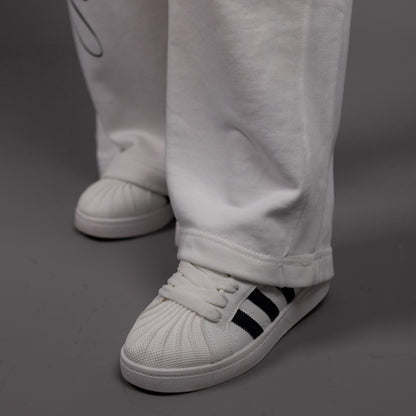 REVER – Baggy Pants – Off White PRINTED Baggy Pants – Premium soft fabric, relaxed fit for ultimate comfort and effortless street style.