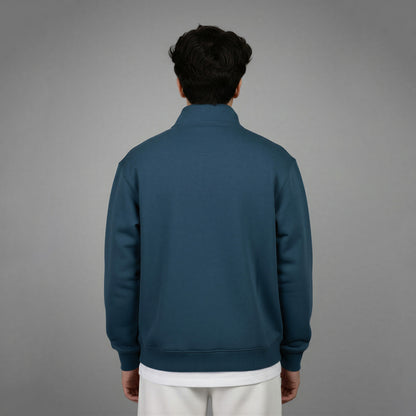 Person wearing a blue jacket on a gray background
