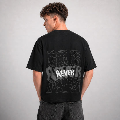 Person wearing a black t-shirt with white graphics and text on the back against a gray background