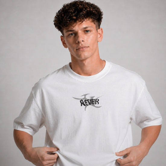 Person wearing a white t-shirt with a logo on a gray background