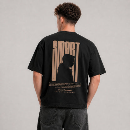 Person wearing a black t-shirt with 'SMART' design on the back against a gray background