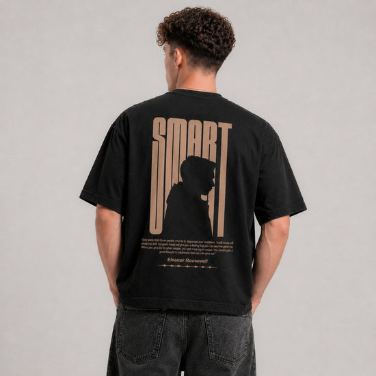 Person wearing a black t-shirt with 'SMART' design on the back against a gray background