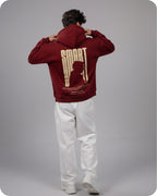 Person wearing a maroon hoodie with 'SMART' design on the back against a gray background