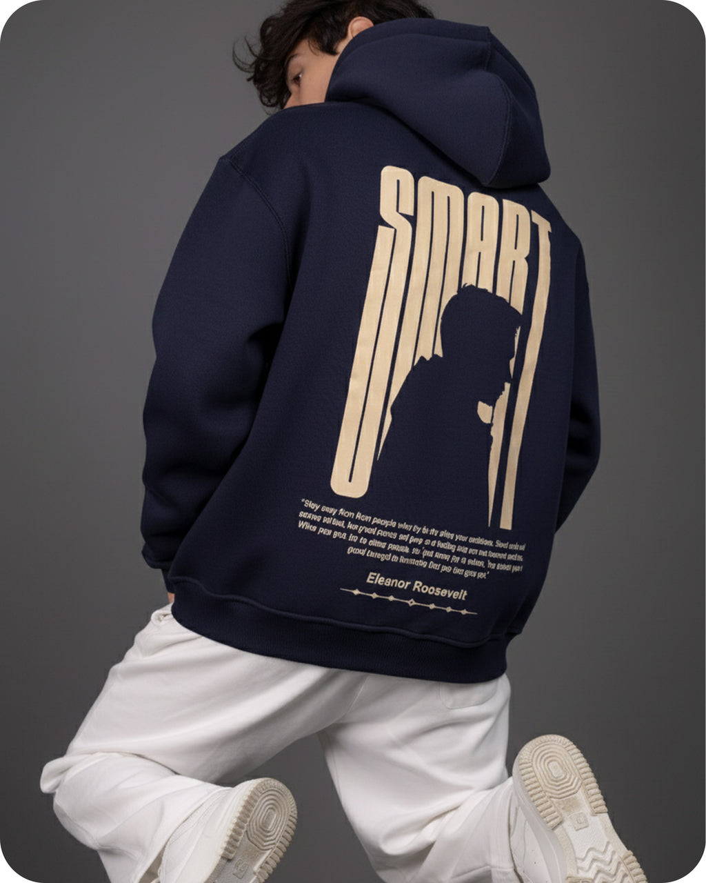 Person wearing a navy hoodie with 'SMART' design on the back, standing against a gray background.