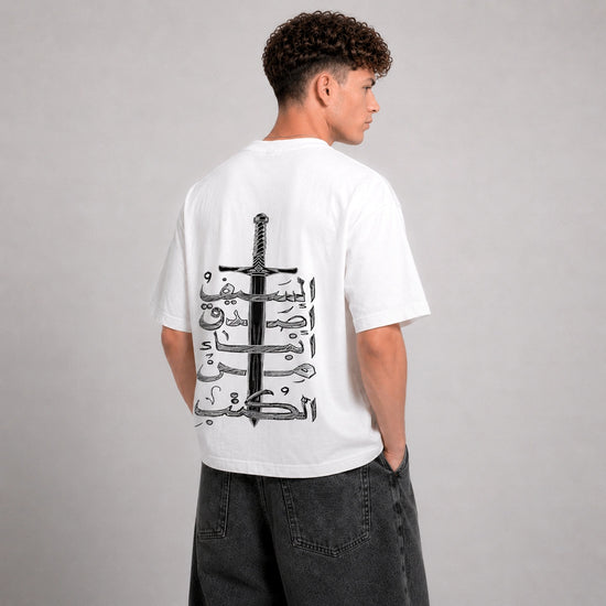 Person wearing a white t-shirt with a black design on the back against a gray background